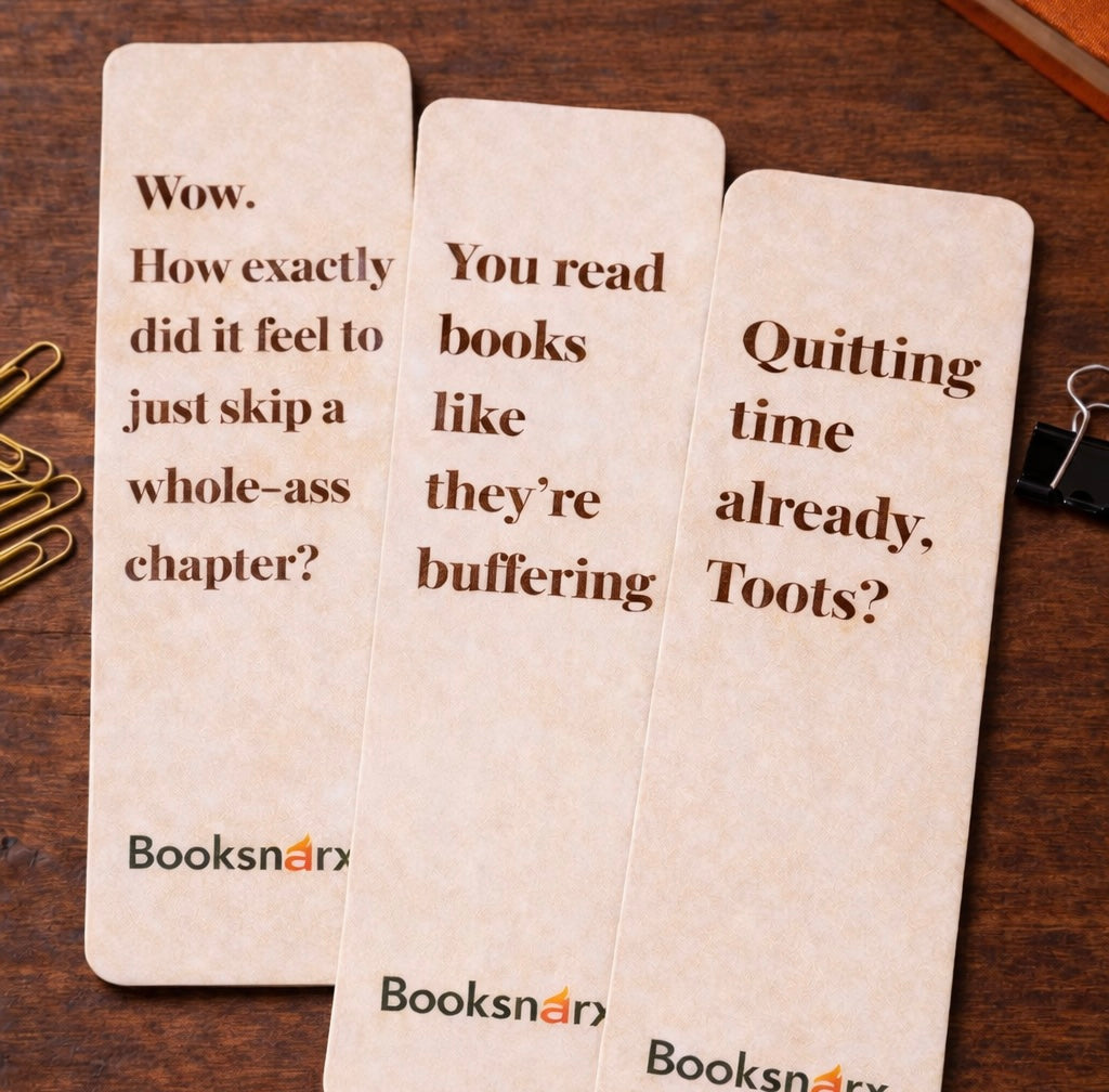 Three humorous bookmarks with quotes on a wooden surface, featuring the brand 'Booksnaar'.